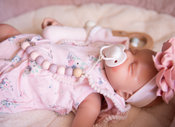 reborn-vs-sensory-comfort-doll-comparison-article-image Article image used for a blog explaining the difference between a reborn doll and a sensory comfort doll