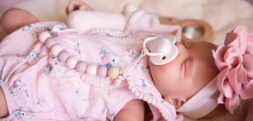 Article image used for a blog explaining the difference between a reborn doll and a sensory comfort doll