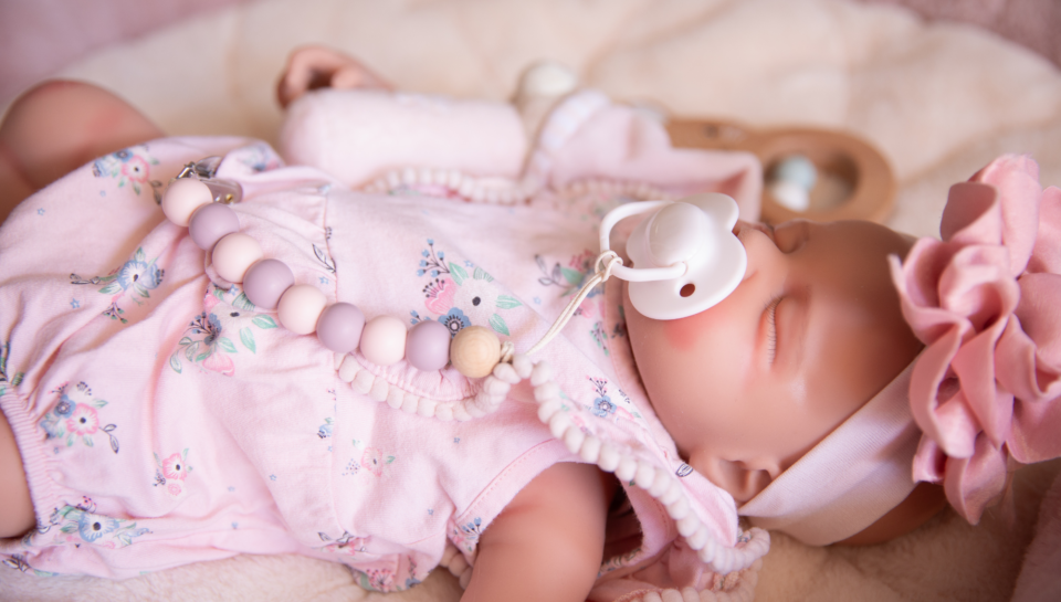 Article image used for a blog explaining the difference between a reborn doll and a sensory comfort doll