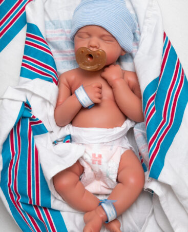 Sweet Snuggles boy full body silicone reborn doll wrapped in blanket with dummy