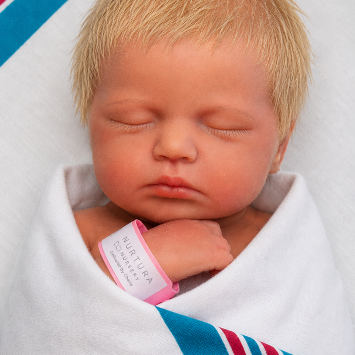 Gentle Comfort girl full body silicone reborn doll Australia, realistic weighted silicone reborn baby, headshot beanie image