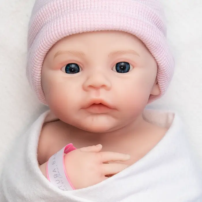 Expressive open-eye detailing captured in a full body silicone reborn doll Australia product image. Curious Wonder girl edition.
